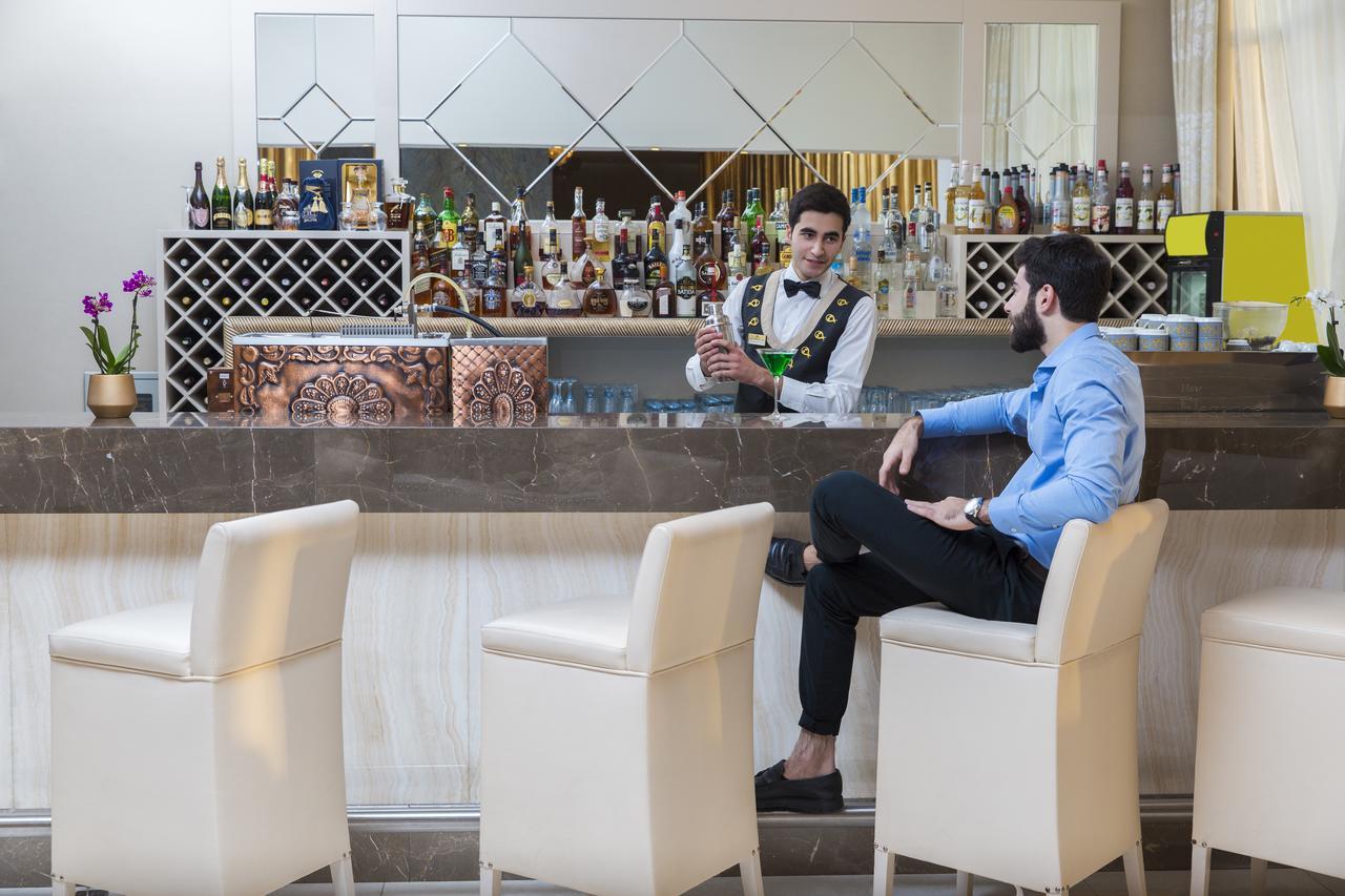 Gabala Garden Hotel Εξωτερικό φωτογραφία A bartender at work