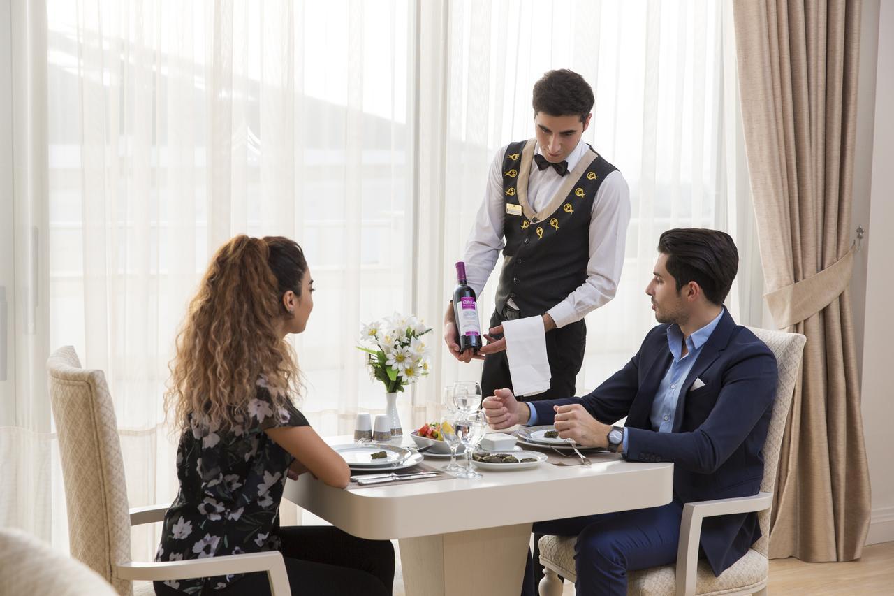 Gabala Garden Hotel Εξωτερικό φωτογραφία A butler serving wine