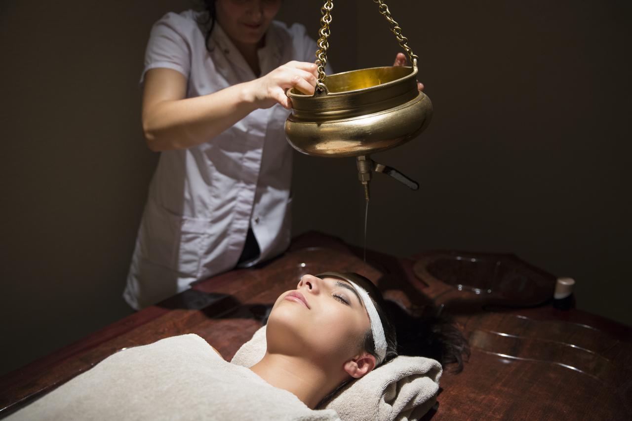 Gabala Garden Hotel Εξωτερικό φωτογραφία A woman receiving a head massage